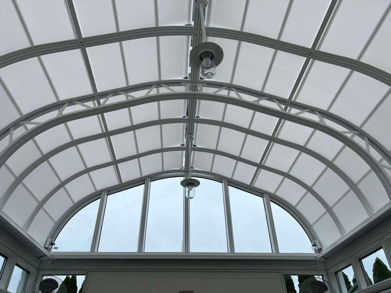 A large white ceiling with a glass roof.