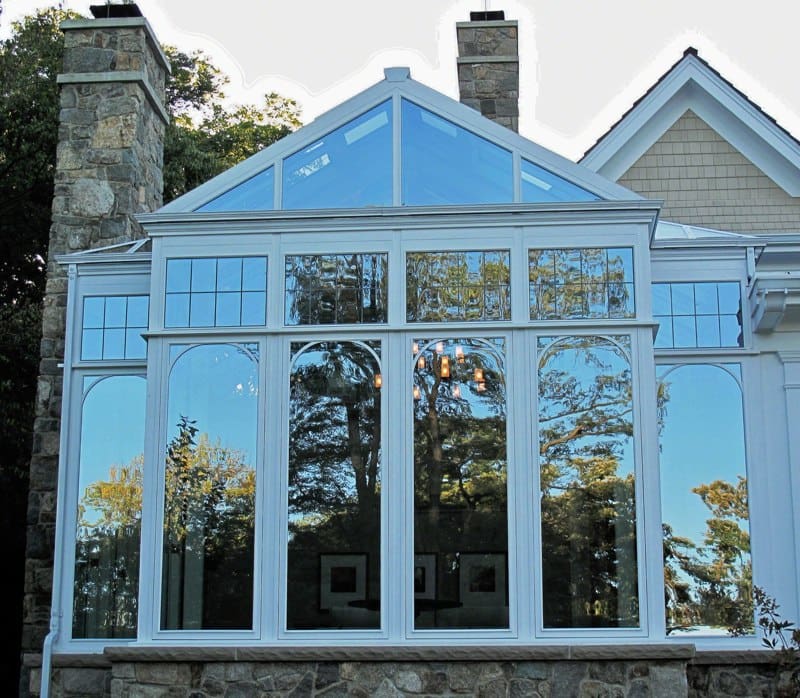 A large window in the middle of a house.