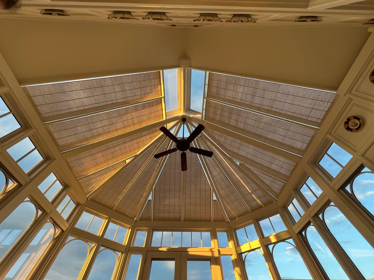 A ceiling fan in the center of a room.