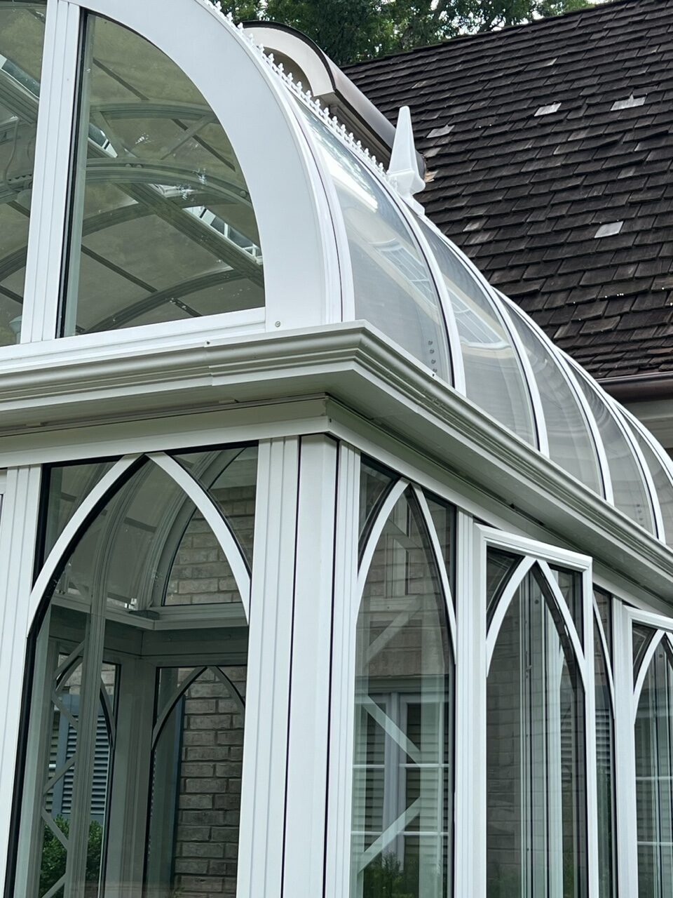 A white building with a large glass roof.