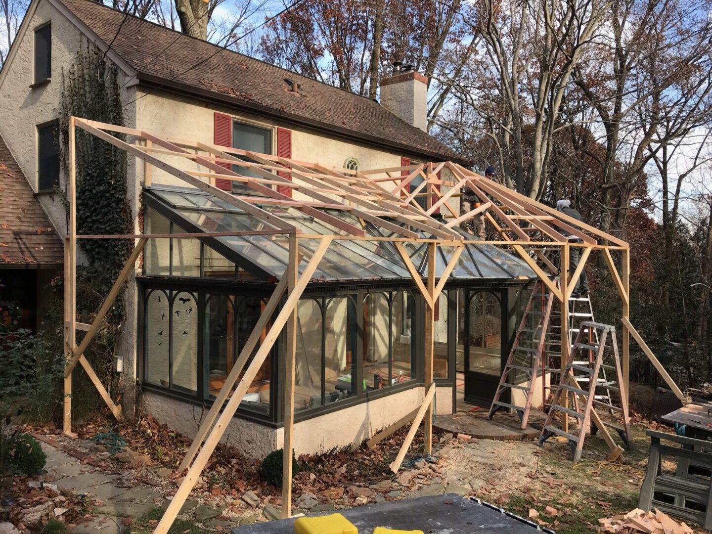 A house being built with scaffolding and wood.