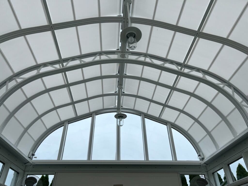 A large white ceiling with a glass roof.