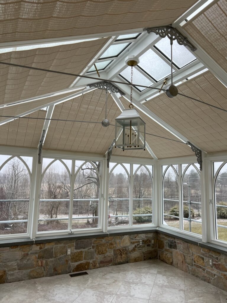 A room with many windows and a ceiling