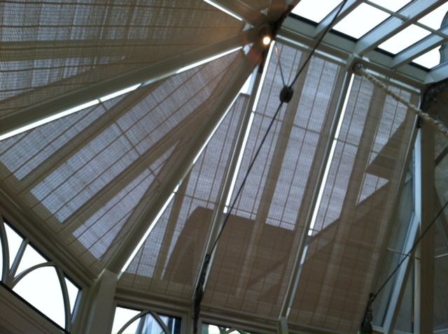 A view of the inside of a building with blinds.